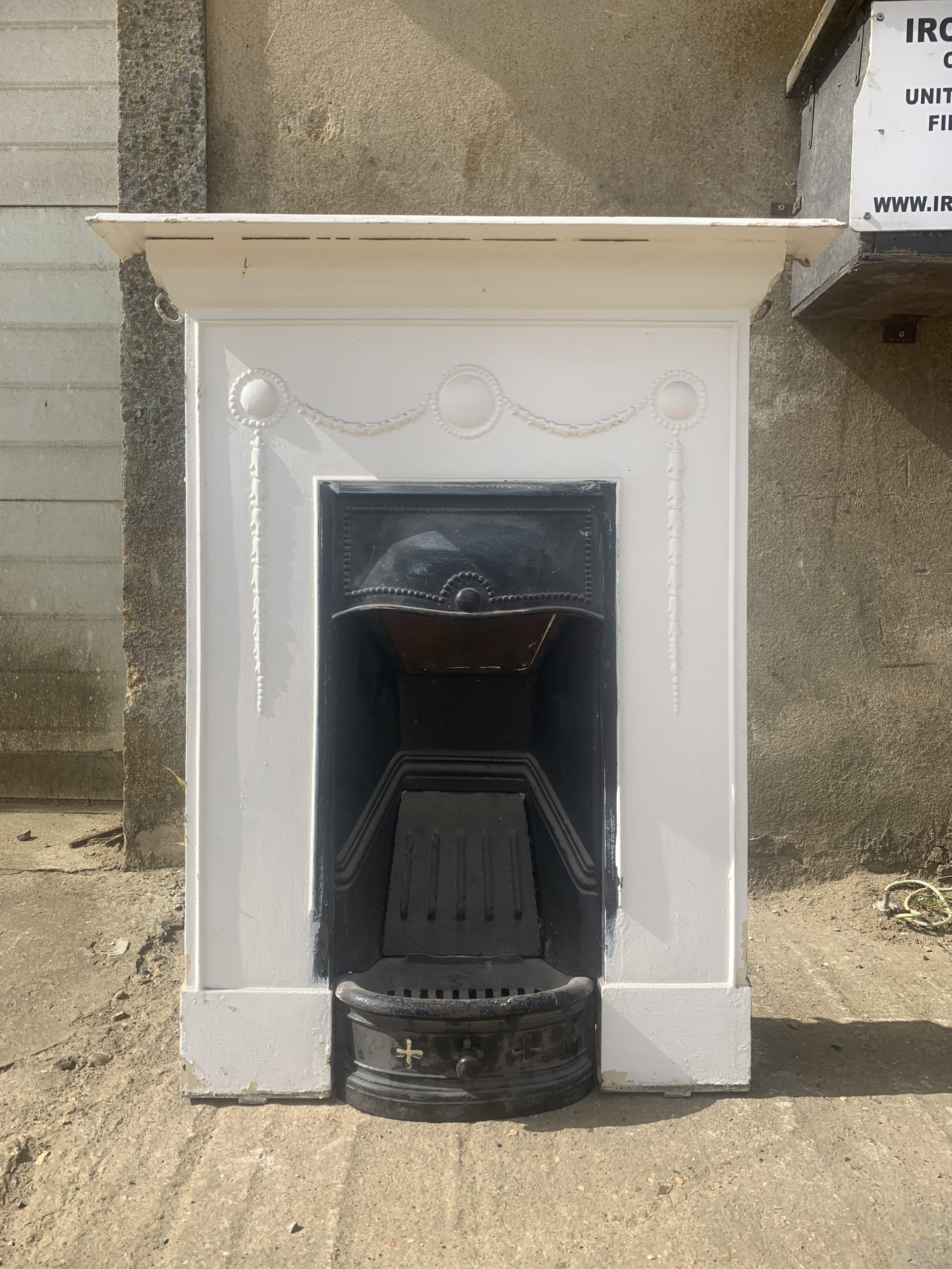 Small castiron combination fireplace - ironwright